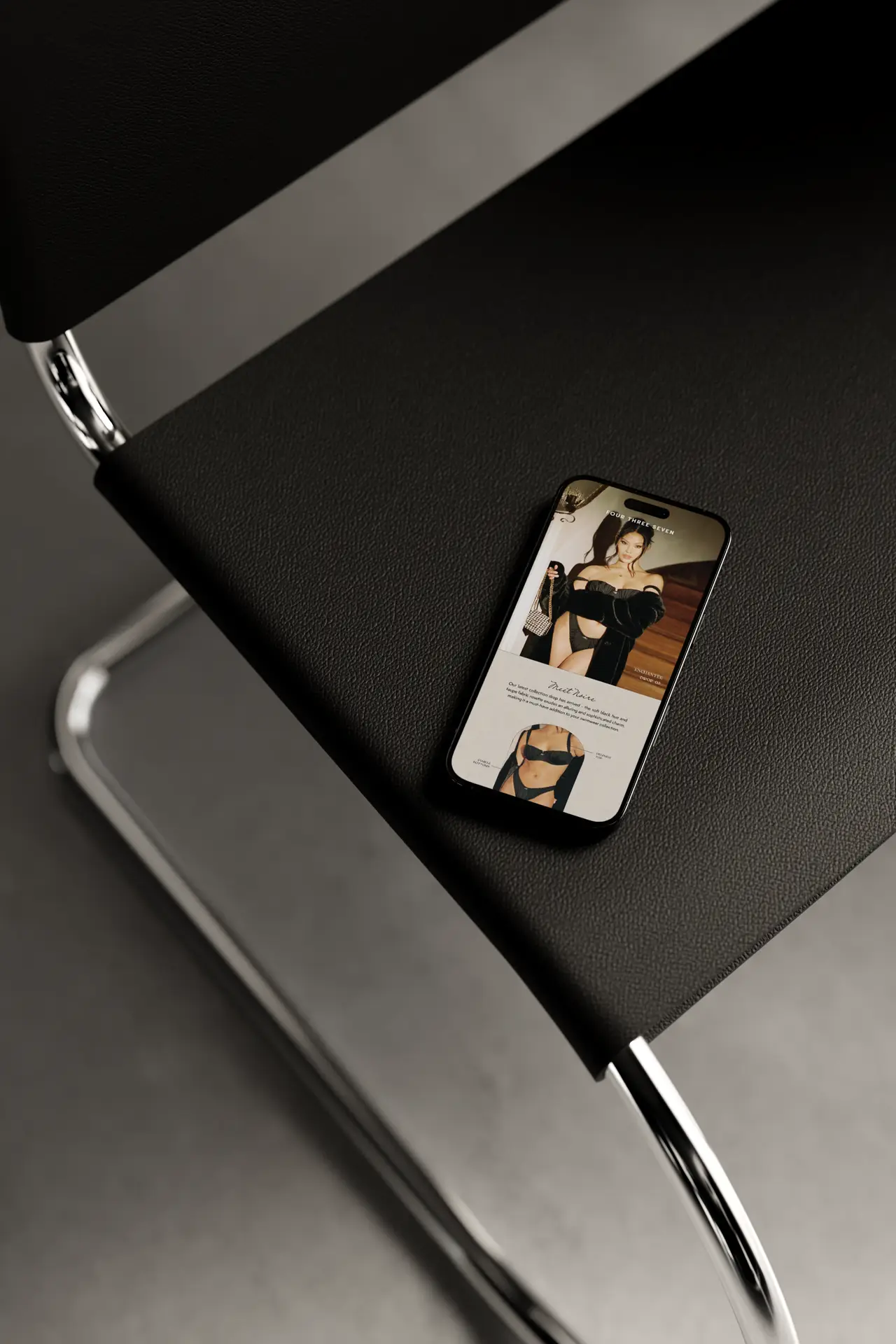 email design in phone mockup on chair